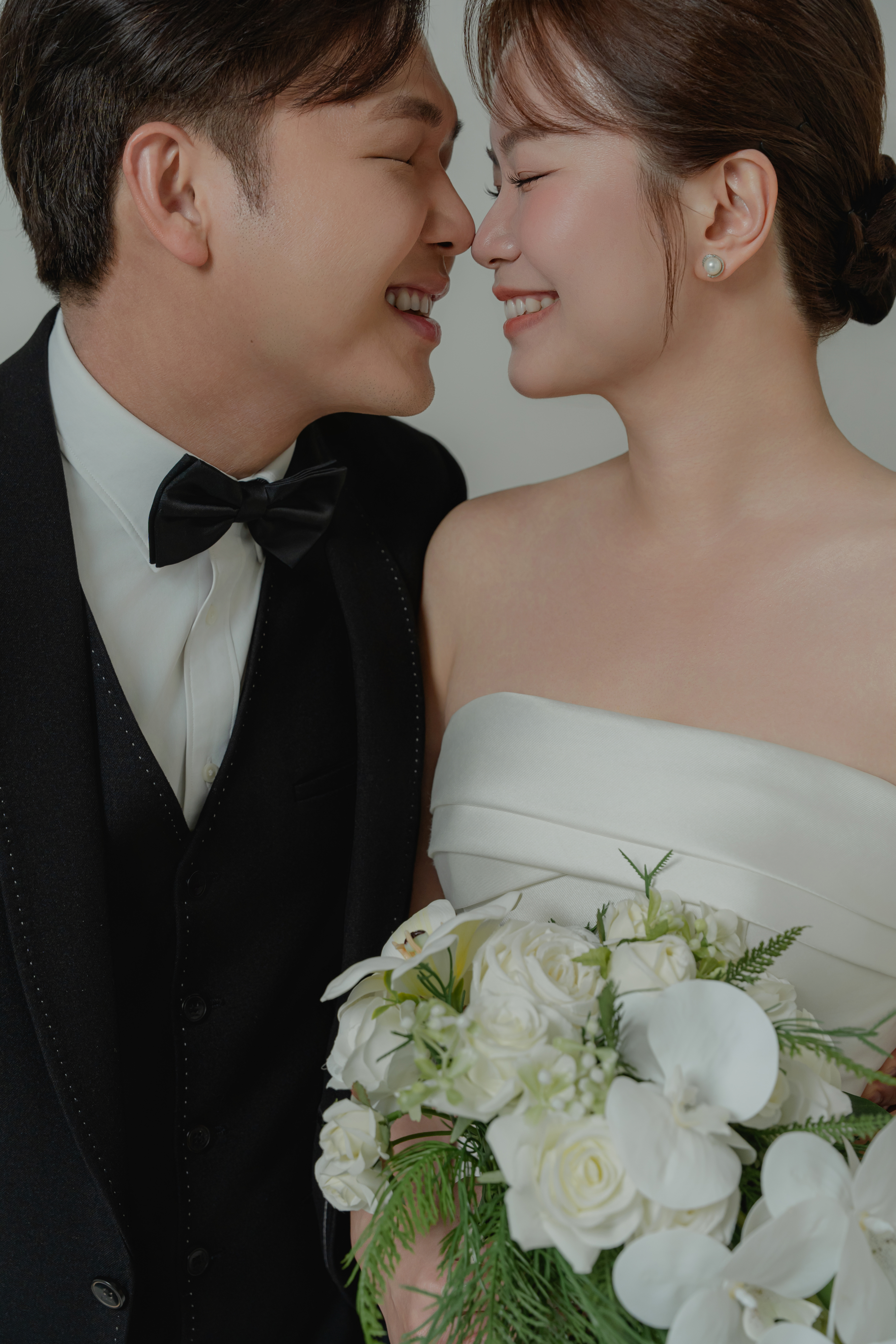 Placeholder wedding photograph of a couple on a staircase